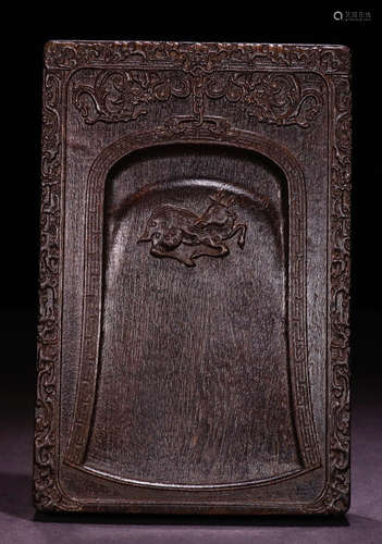 A CHENXIANG WOOD INK SLAB CARVED WITH BEAST PATTERN