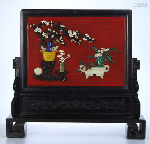 A RED BASE WOOD SCREEN EMBEDDED WITH GEM