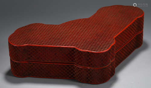 A RED LACQUER BOX CARVED WITH PATTERN