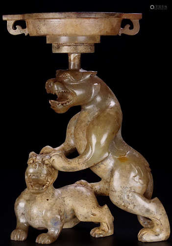 AN ANTIQUE JADE CANDLE HOLDER SHAPED WITH BEAST