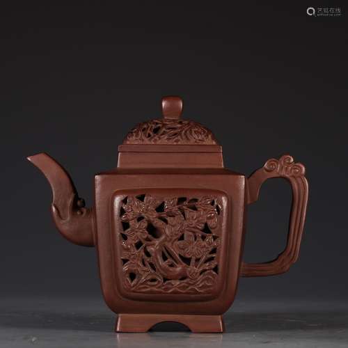 A Chinese Zisha Teapot Of Plum Flower