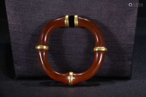 A Chinese Agate Bangle With Gilding