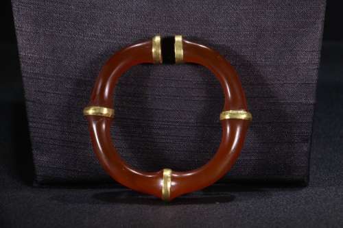 A Chinese Agate Bangle With Gilding