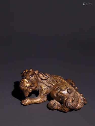 A Chinese Bronze Beast Ornament With Gold Painting