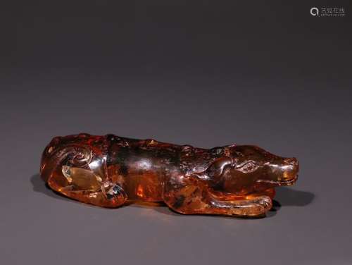 A Chinese Amber Dog Ornament