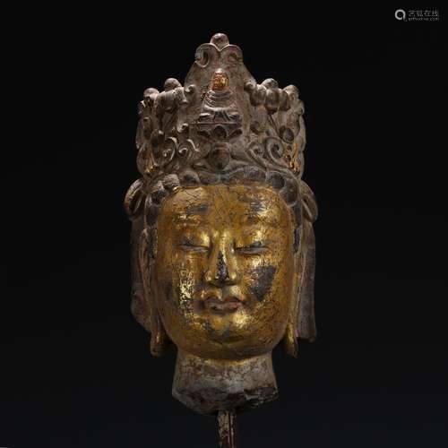 A Chinese Stone Buddha Head With Golden Painting