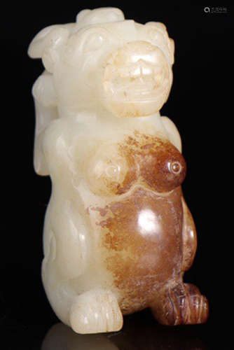 A HETIAN JADE CARVED BEAST SHAPE PENDANT