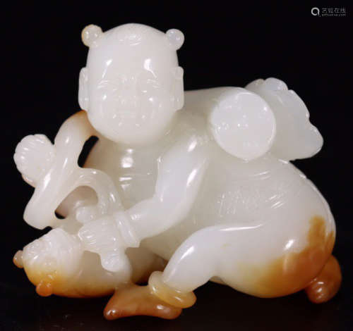 A HETIAN JADE CARVED CHILD SHAPE PENDANT