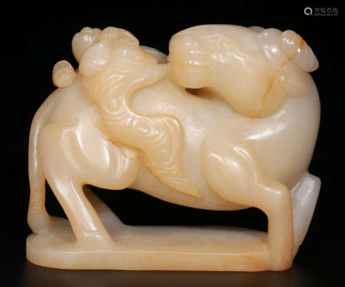 A HETIAN JADE CARVED CHILD BULL SHAPE PENDANT