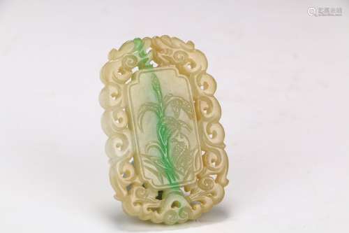 A  Hollowed-out Jadeite Pendant with Flower and Bird Designs         in the seventeenth century