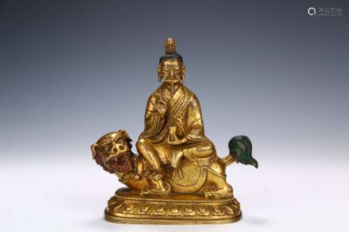 A Gilt Bronze  Statue of A Buddhist Master Sitting on A Beast    in the sixteenth century