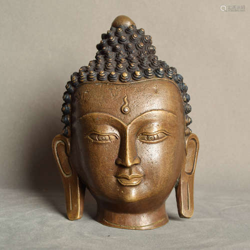 A Chinese Copper Alloy Buddha Head Ornament