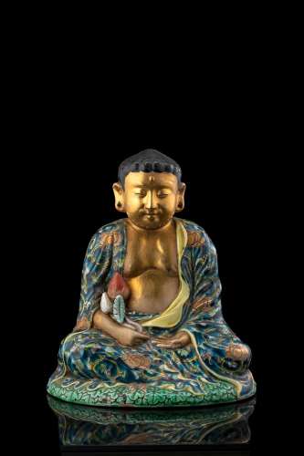 A small polychrome ceramic Buddha China, Republic period (1912-1949) (h. 21.5 cm.)...