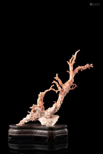 A coral carving of blossoming branches and birds, on wood stand (defects and restorations) China, early 20th century (h. tot 30 cm.; gross weight 690 gr.) This lot may be subject to Import/Export restrictions due to CITES regulations in s...