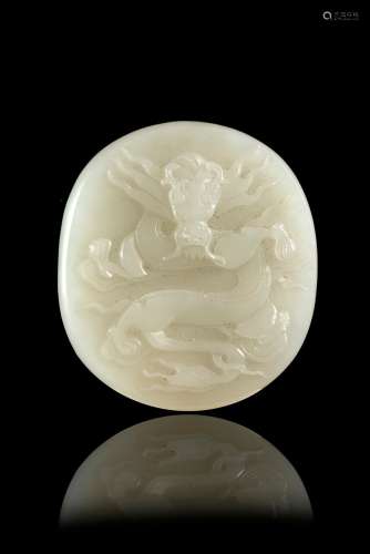 A white jade plaque decorated with a dragon and bamboo China, 20th century (l. max 4.9 cm.)...