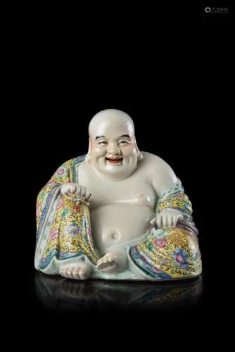 A smiling porcelain Budai, marked under the base China, Republic period (1912-1949) (h. 24 cm.)...