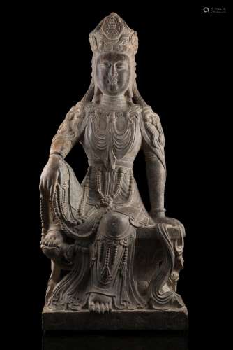 A carved stone figure of seated Bodhisattva Guanyin (slight defects) China, Qing dynasty (1644-1911) (h. 60 cm.)...