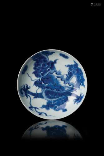 A blue and white dragon dish, Yongzheng mark and period (defects) (d. 15.5 cm.)...