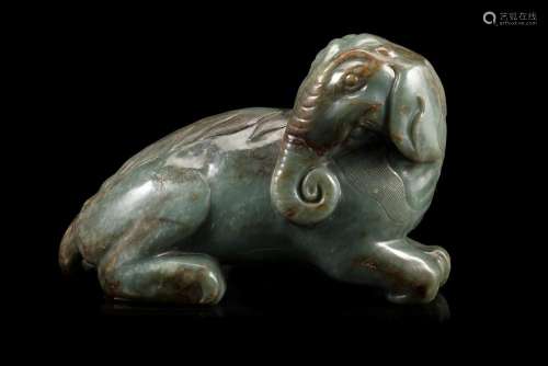 A flecked green jade elephant, wood base China, 20th century (l. max 24 cm.)...