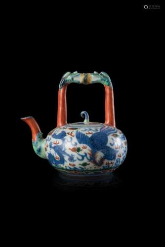 A porcelain teapot with dragons and phoenix decorations, apocryphal Wanli mark, with certificate (defects) China, 19th century (h. 13 cm.)...