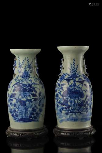 A pair of celadon-ground baluster vases with blue decoration, on wood stands China, late Qing dynasty (1644-1911) (h. 43.5 cm.)...