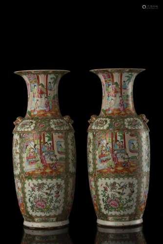 A pair of famille rose Cantonese vases, decorated with figures (slight defects) China, 19th century (h. 60 cm.)...