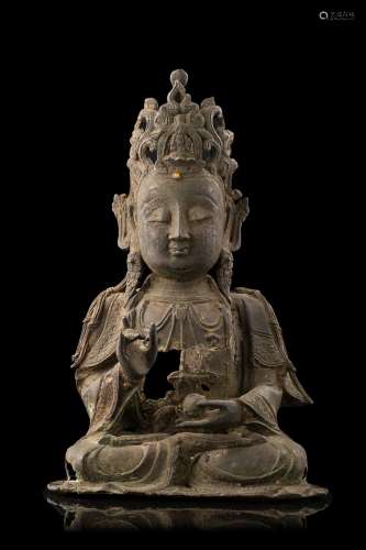A burnished and partially gilt bronze Buddha on plexiglass base (major defects) China, Ming dynasty (1368-1644) (h. 31 cm.)...