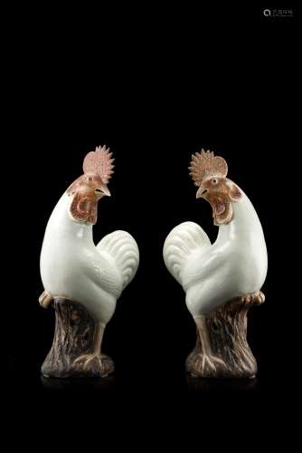 A pair of stoneware roosters (restorations) China, late 18th century (h. 44.5 cm.)...