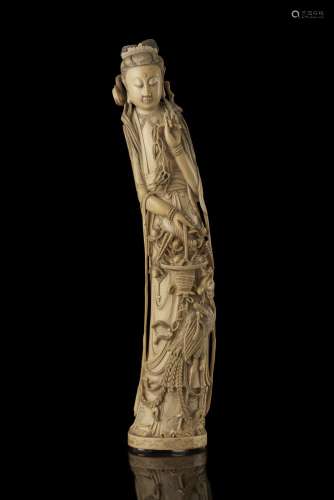 A large ivory sculpture of a lady holding a blossoming branch (defects and breakage) China, late Qing dynasty (1644-1911) (h. 60 cm.) This lot may be subject to Import/Export restrictions due to CITES regulations in some extra UE countrie...