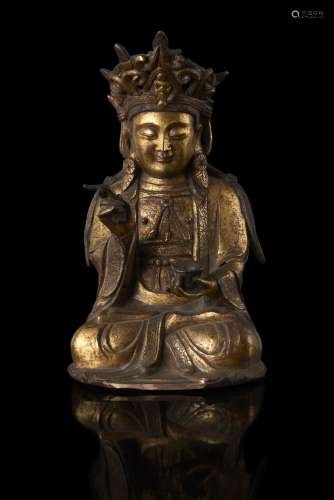 A gilt bronze seated Guanyin, late Ming dynasty (defects and losses) China, Ming dynasty, 17th century (h. 22.5 cm.)...