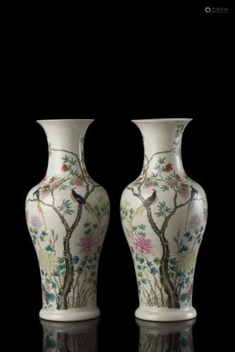 A pair of white porcelain vases, painted with flowers, pomegranates and birds, Shen De Tang Zhi apocryphal mark (defects) China, Republic period (1912-1949) (h. 42.5 cm.)...
