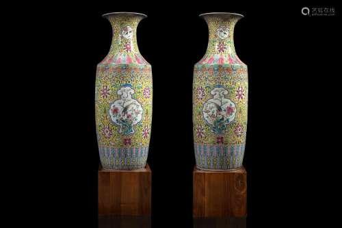 A pair of large Family Rose on yellow ground baluster vases, decorated with floral patterns, apocryphal 