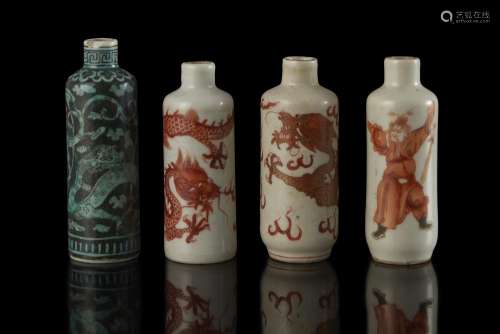 Four porcelain snuff bottles, three with apocryphal marks, one unmarked (defects and losses) China, 19th century (h. max 8.5 cm.)...
