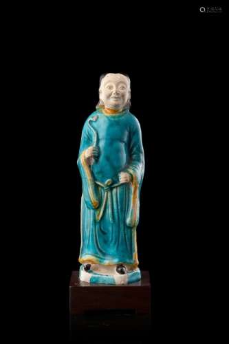 A glazed ceramic figure, on wood stand (defects) China, Ming dynasty (1368-1644) (h. 17 cm.)...