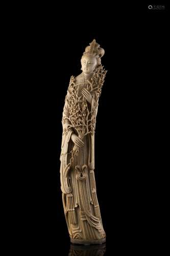 An ivory carving of a lady holding a branch China, early 20th century (h. 65.5 cm.) This lot may be subject to Import/Export restrictions due to CITES regulations in some extra UE countries...