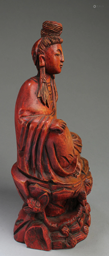 A Carved Wood Deity Statue