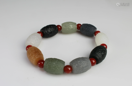 A Nephrite Jade Bead Bracelet, 9 beads