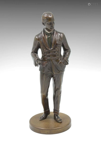 PATINATED BRONZE SCULPTURE OF WELL-DRESSED…