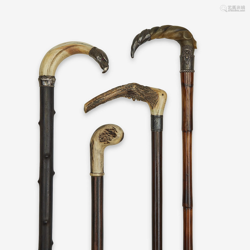 A group of four horn and antler-mounted canes, Va…