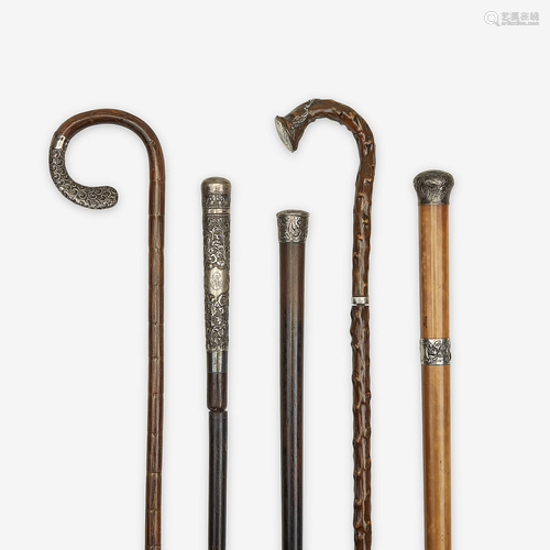 A group of five silver-mounted canes, Various dates