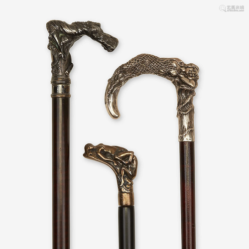 A group of three silver-mounted erotic canes, Various