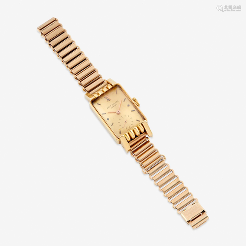 An eighteen karat gold wristwatch with later nine k…