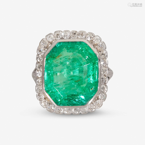 An emerald, diamond, and platinum ring,