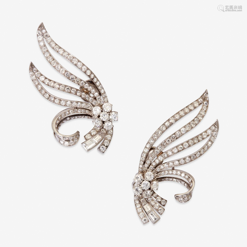 A pair of diamond and platinum earclips, Mellerio,