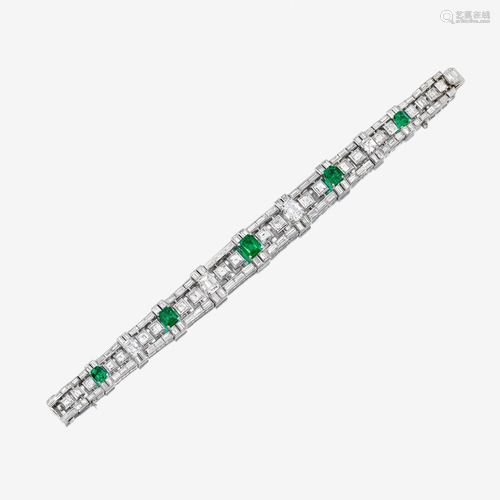 A diamond, emerald, and eighteen karat white gold