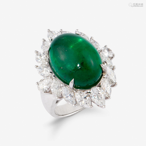 An emerald, diamond, and platinum ring,