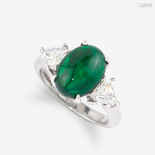 An emerald, diamond, and platinum ring,