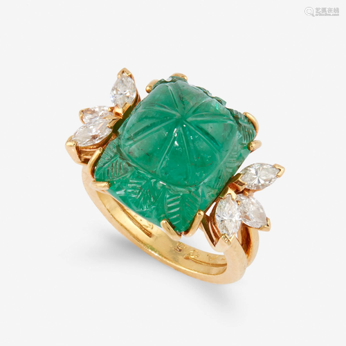 An emerald, diamond, and eighteen karat gold ring,