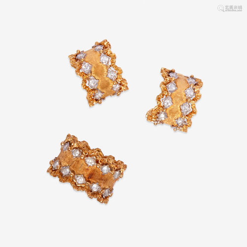 A pair of eighteen karat gold and diamond earrings and