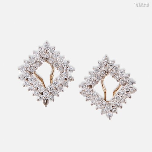 A pair of platinum and diamond earclips, Angela